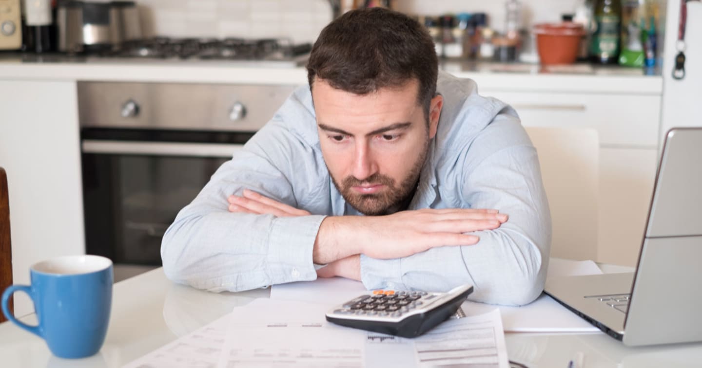 Man examining paperwork.