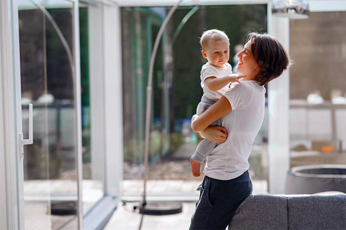 Mother with baby at home.