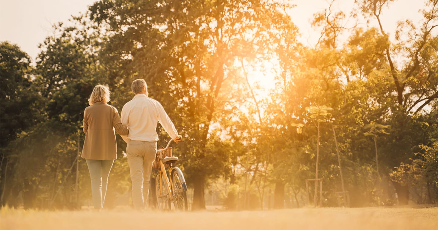 Retired couple riding bikes.