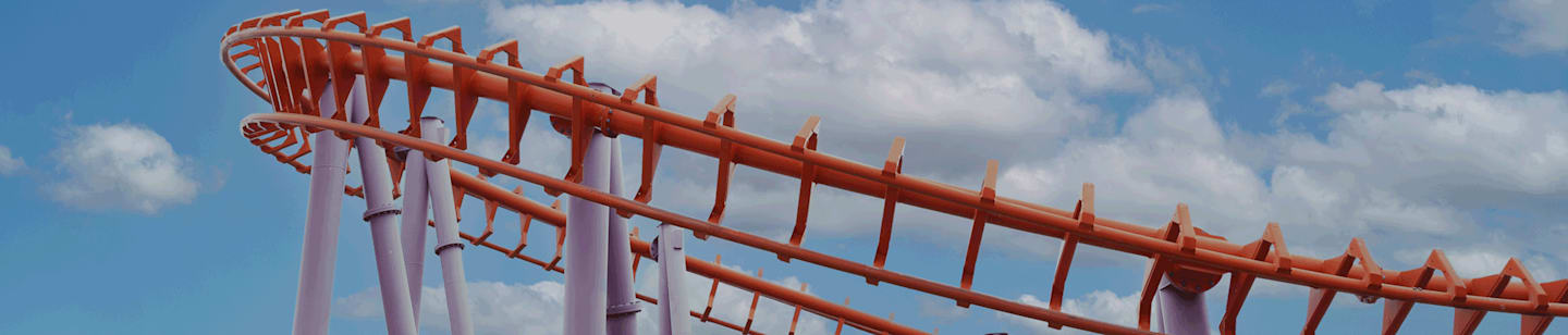 A section of roller coaster track against the sky.