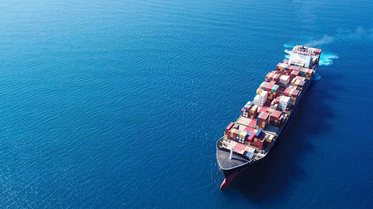 Shipping barge on open water.