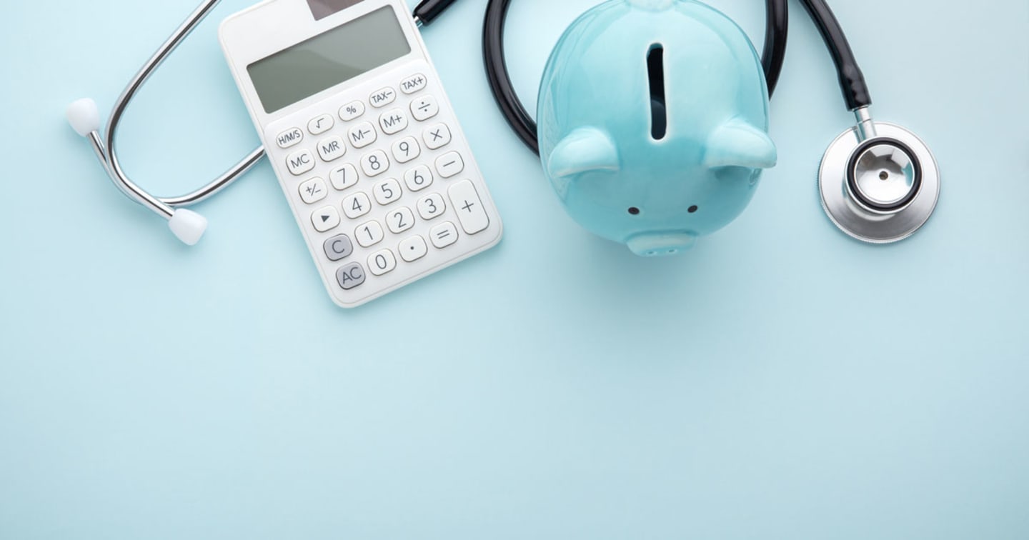 A stethoscope, calculator, and a piggy bank.