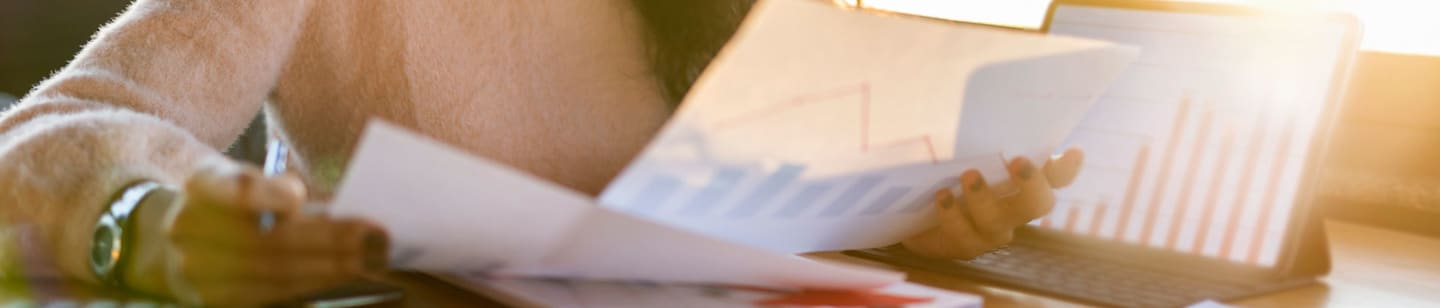 A woman looking through papers.