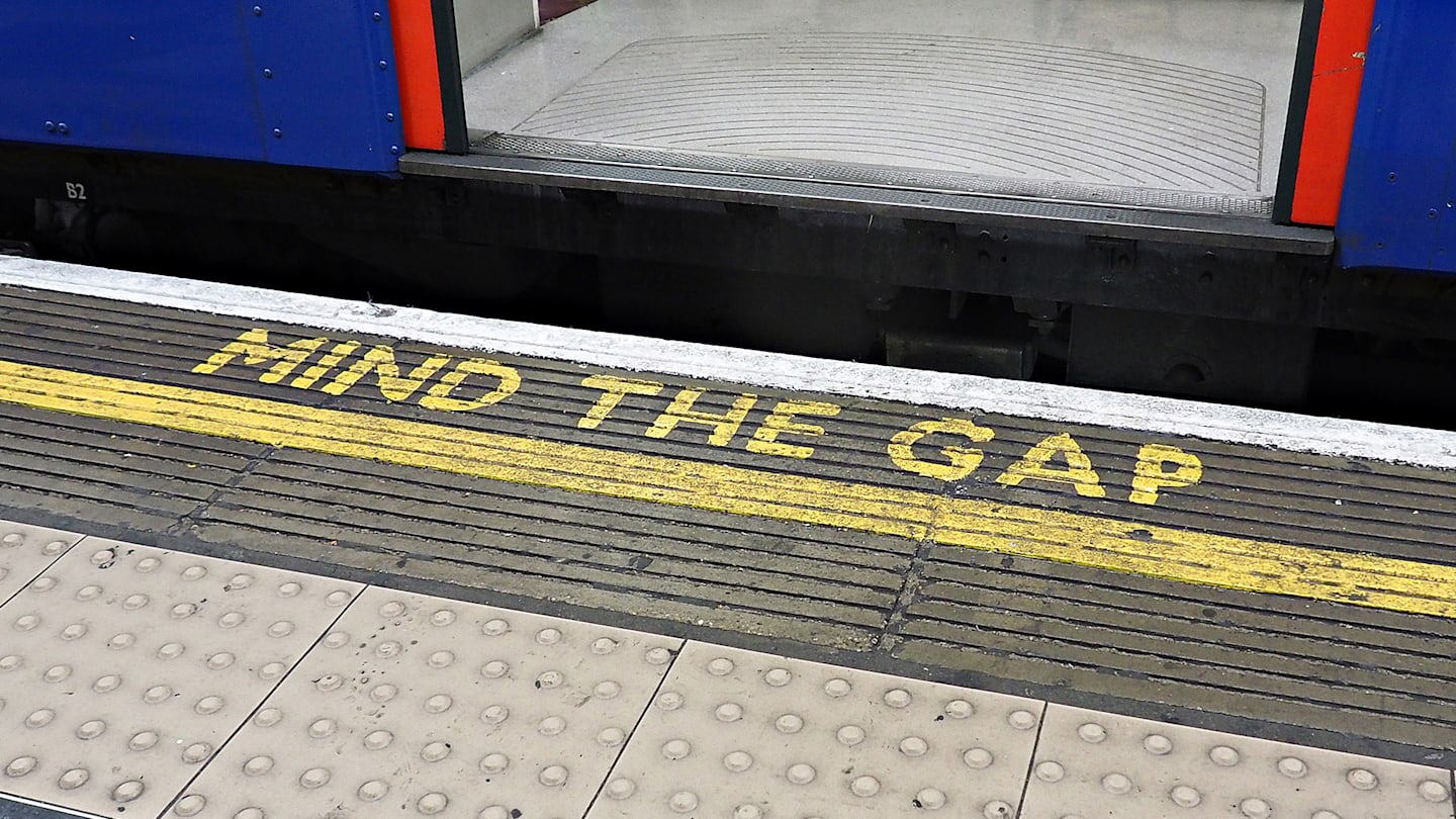 Subway station with Mind the Gap message.