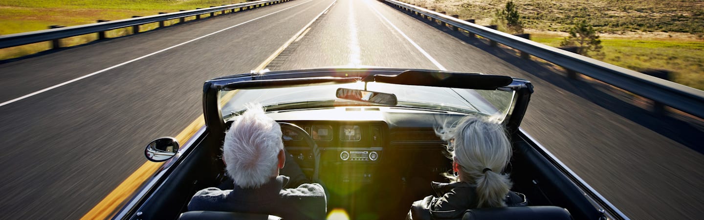 Retired couple in convertible.