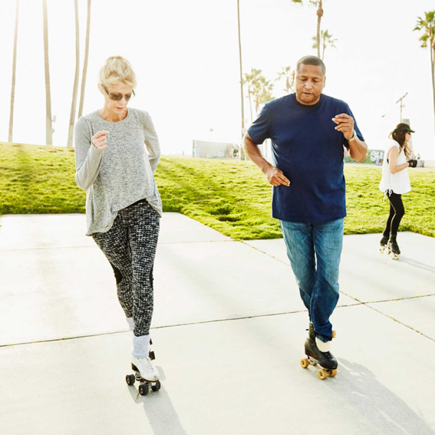 Retired couple roller skating.