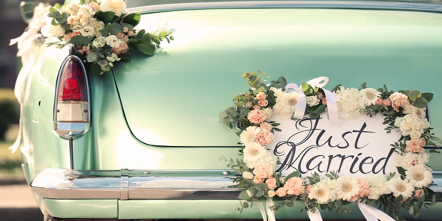 Just Married sign on back of car.