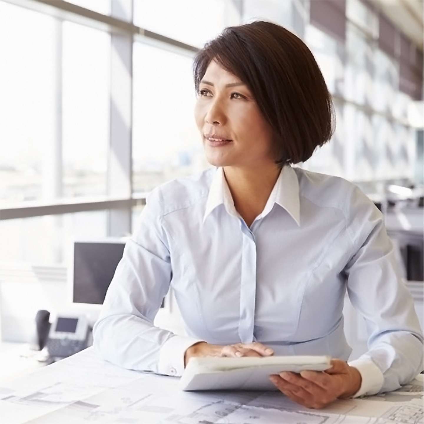 Woman working at desk.