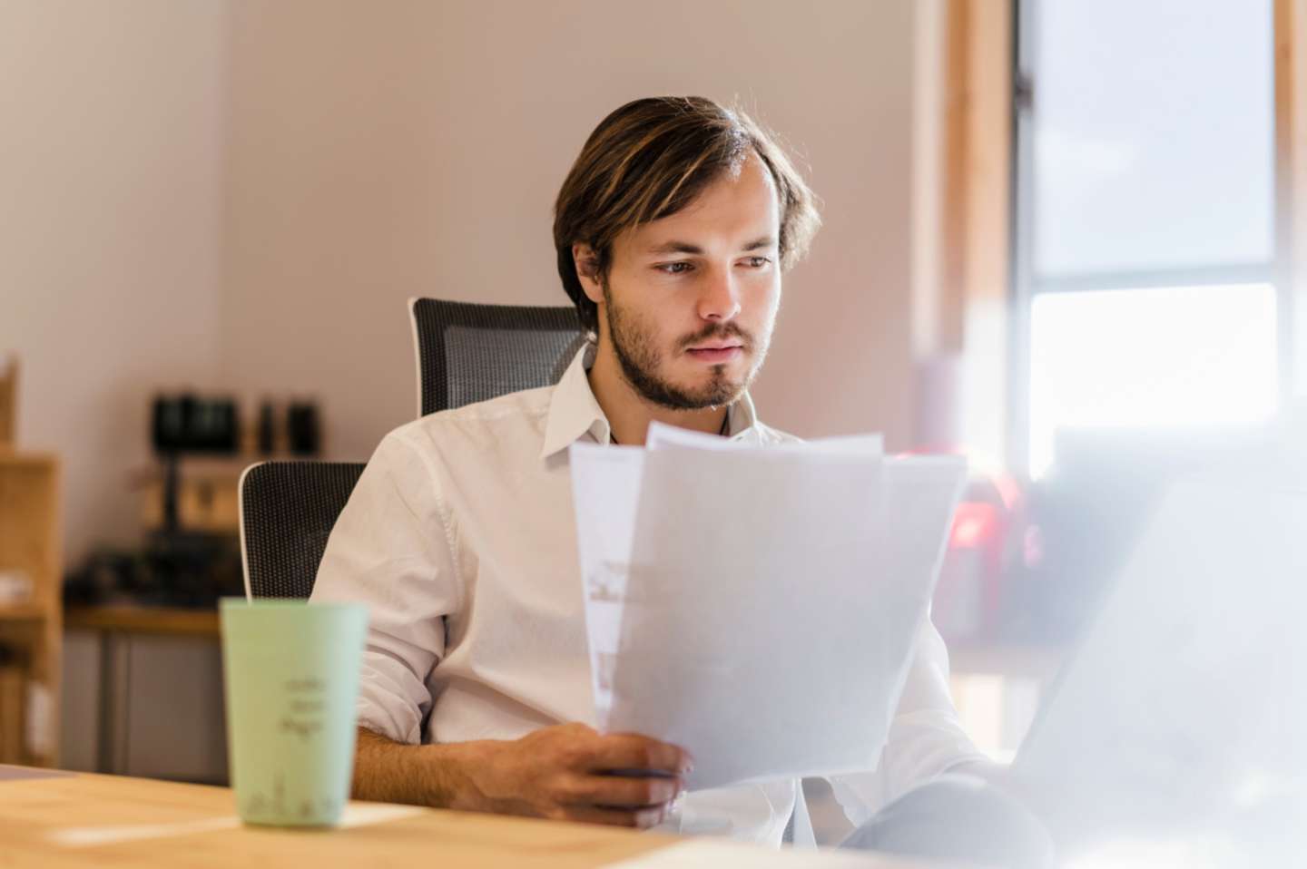 Man studying paperwork.