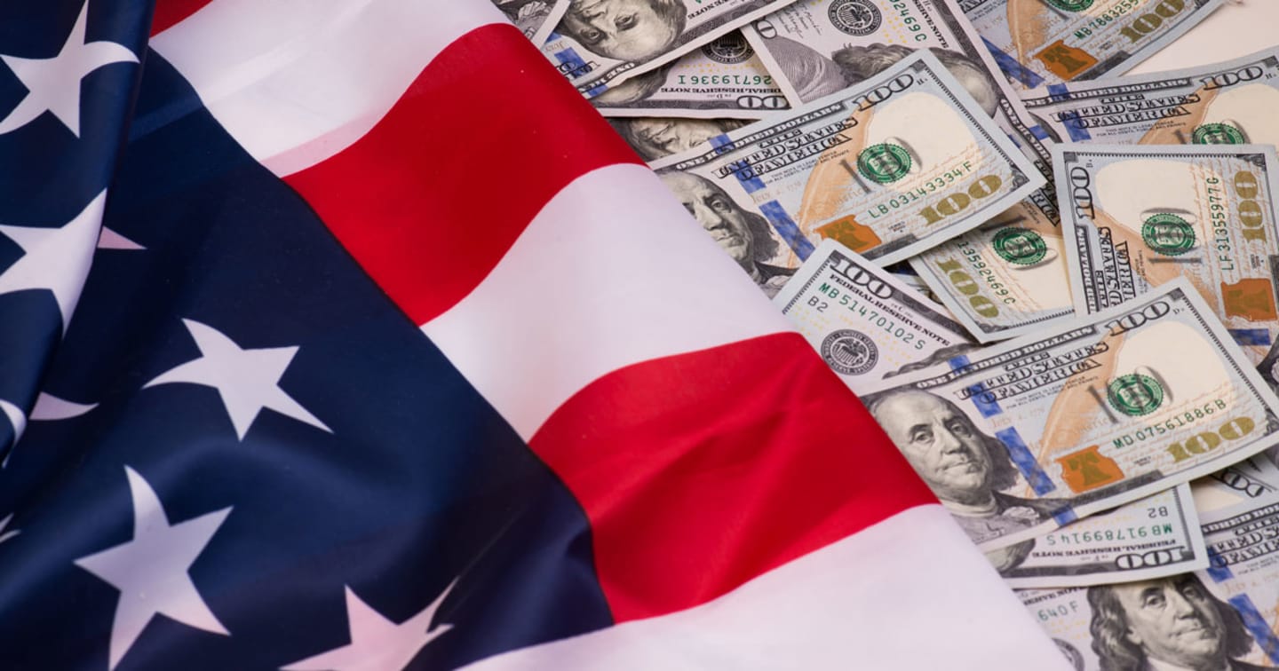 American flag and $100 bills