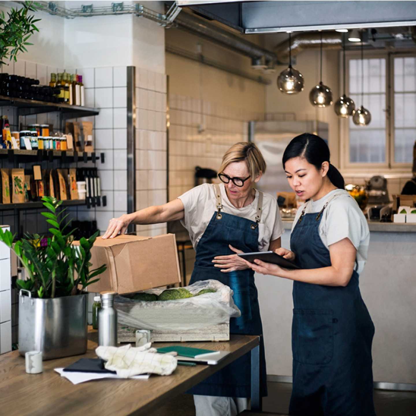 Two workers in a coffee shop.