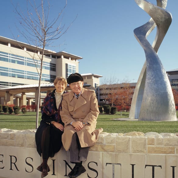 Jim and Virginia Stowers sitting in front of the Stowers Institute for Medical Research in Kansas City, Missouri.