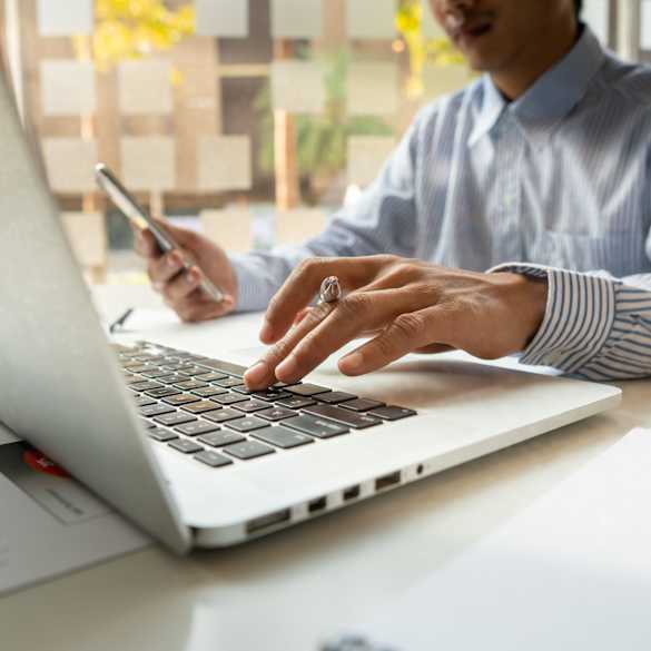 Person on laptop at home.